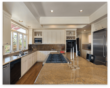 A well-equipped kitchen showcasing a stove, oven, refrigerator, sink, and elegant customizable granite countertops.