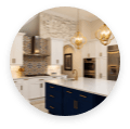 Blue kitchen cabinets with white granite countertops.