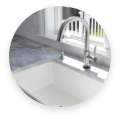 Soapstone Countertops in kitchen with sink, faucet, window