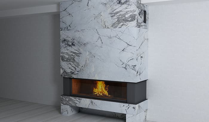 Modern marble fireplace with a clean, sleek design, featuring a warm fire. The marble's gray and white veining adds an elegant touch to the room.