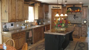 A kitchen with a wooden table and four chairs.