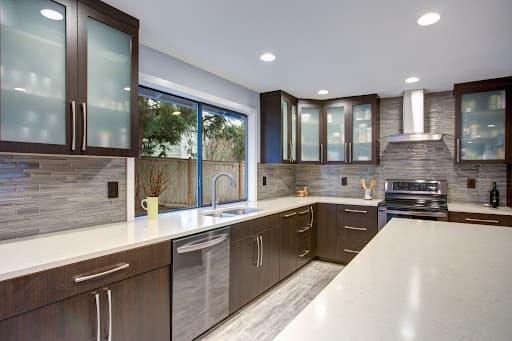 A well-designed kitchen displaying stainless steel appliances alongside rich wood cabinets, highlighting a blend of functionality and style.