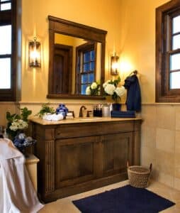 Interior of a bathroom featuring sink, mirror, and bathtub.