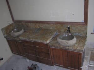 Bathroom with two sinks and mirror in kitchen style.
