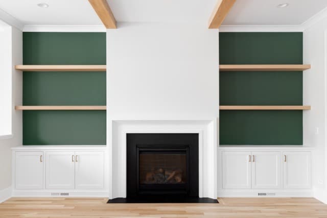 Fireplace with built-in shelves on both sides