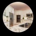 Bright kitchen with white cabinetry, sleek stainless steel appliances, and beautiful quartzite countertops.