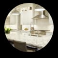 Modern kitchen featuring white cabinets and quartz countertops.